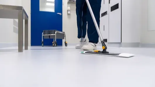 Person Cleaning Floor